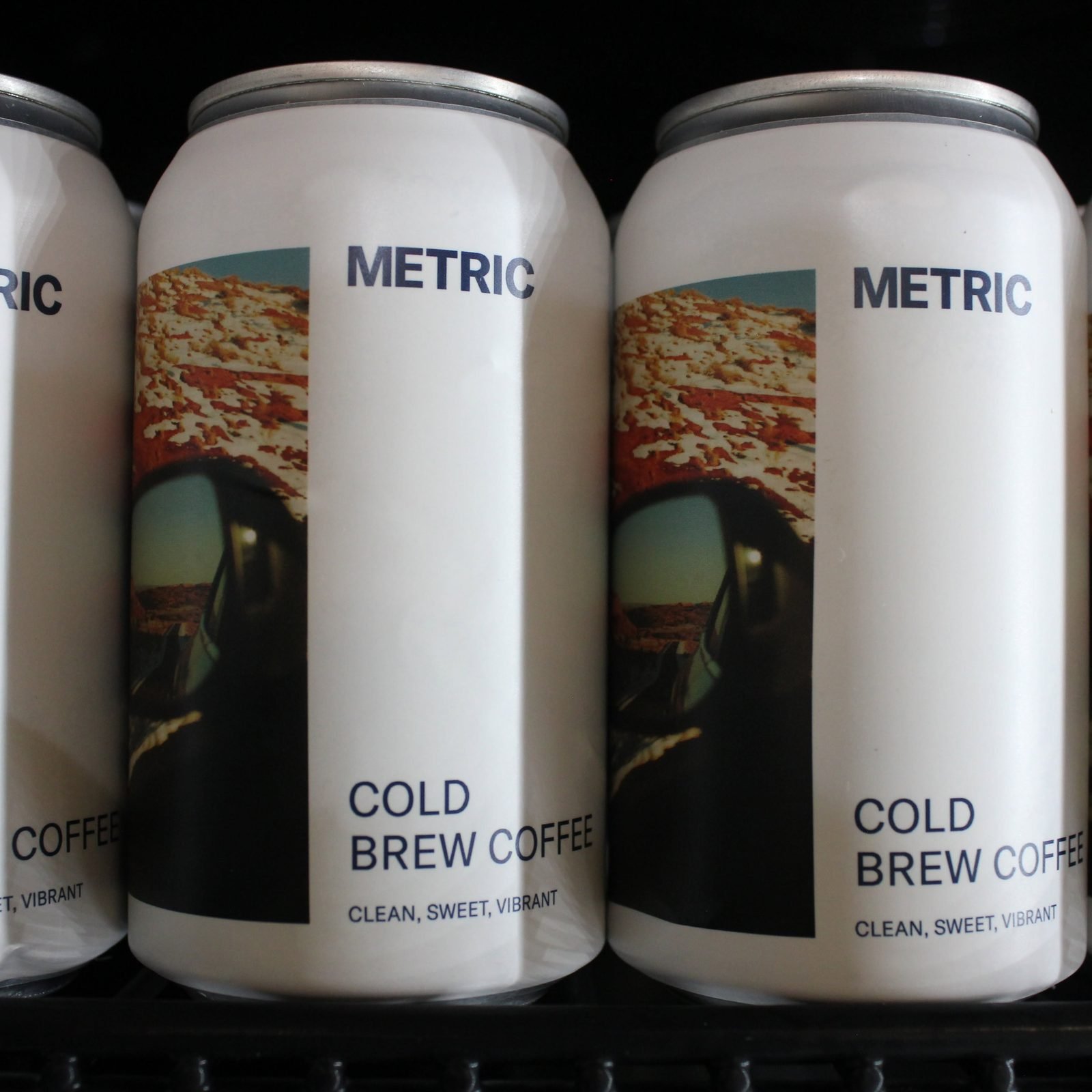 Cans of Metric cold brew coffee